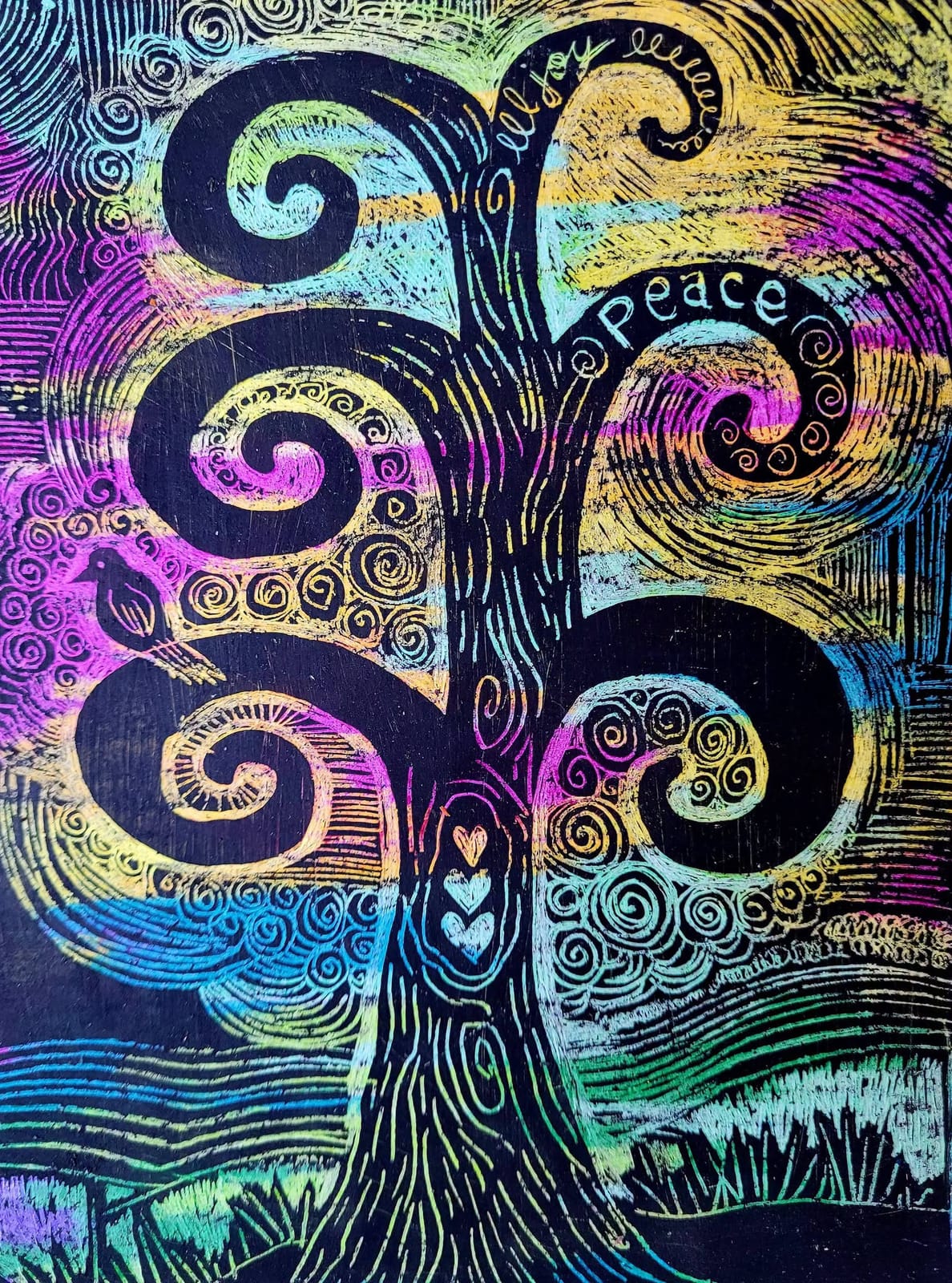 A scratch-art tree of swirling black branches with a small bird and the word Peace, rainbow colours showing through.